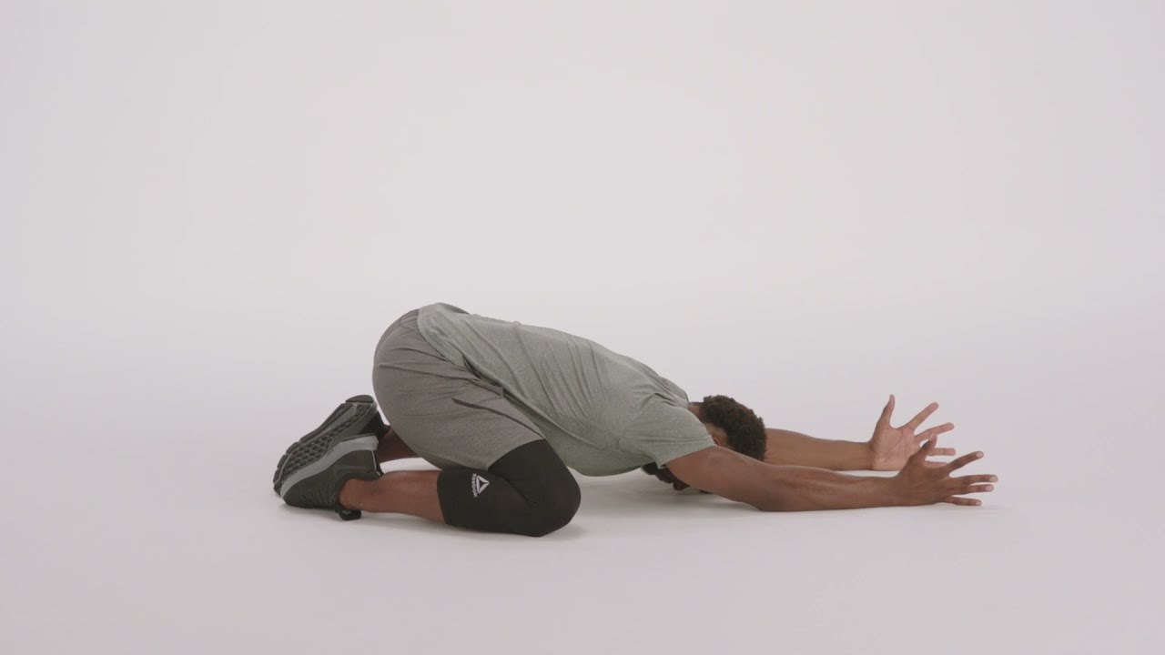 Child's Pose demonstrated by a NASM presenter (frame from NASM's official YouTube video)