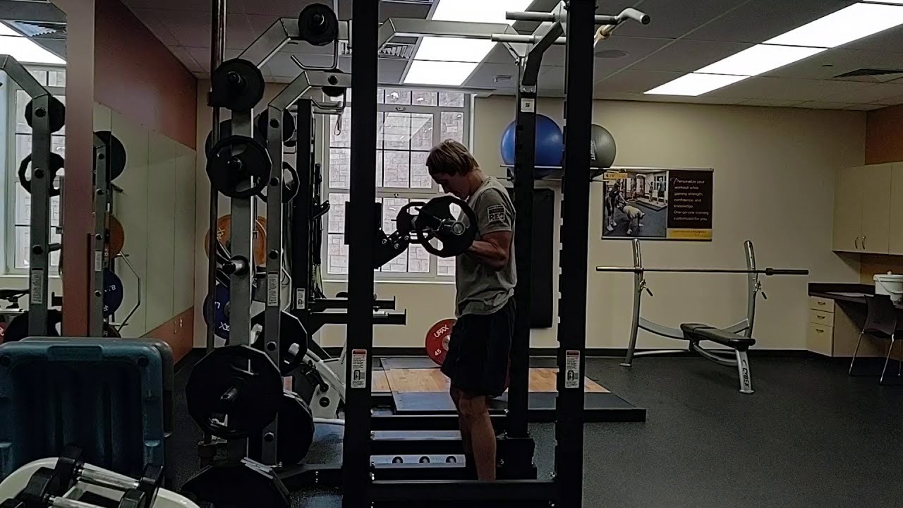 Barbell Bicep Curl demonstrated by University of Wyoming Campus Recreation staff (frame from official video)