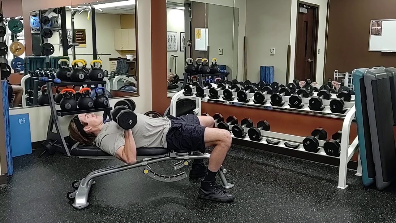 Dumbbell Bench Press demonstrated by University of Wyoming Campus Recreation staff (frame from official video)