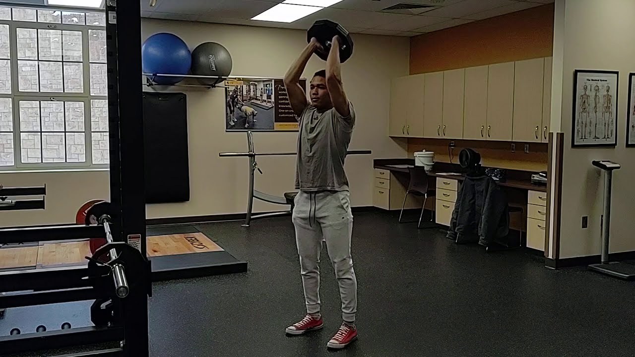 Overhead Tricep Extension demonstrated by University of Wyoming Campus Recreation staff (frame from official video)