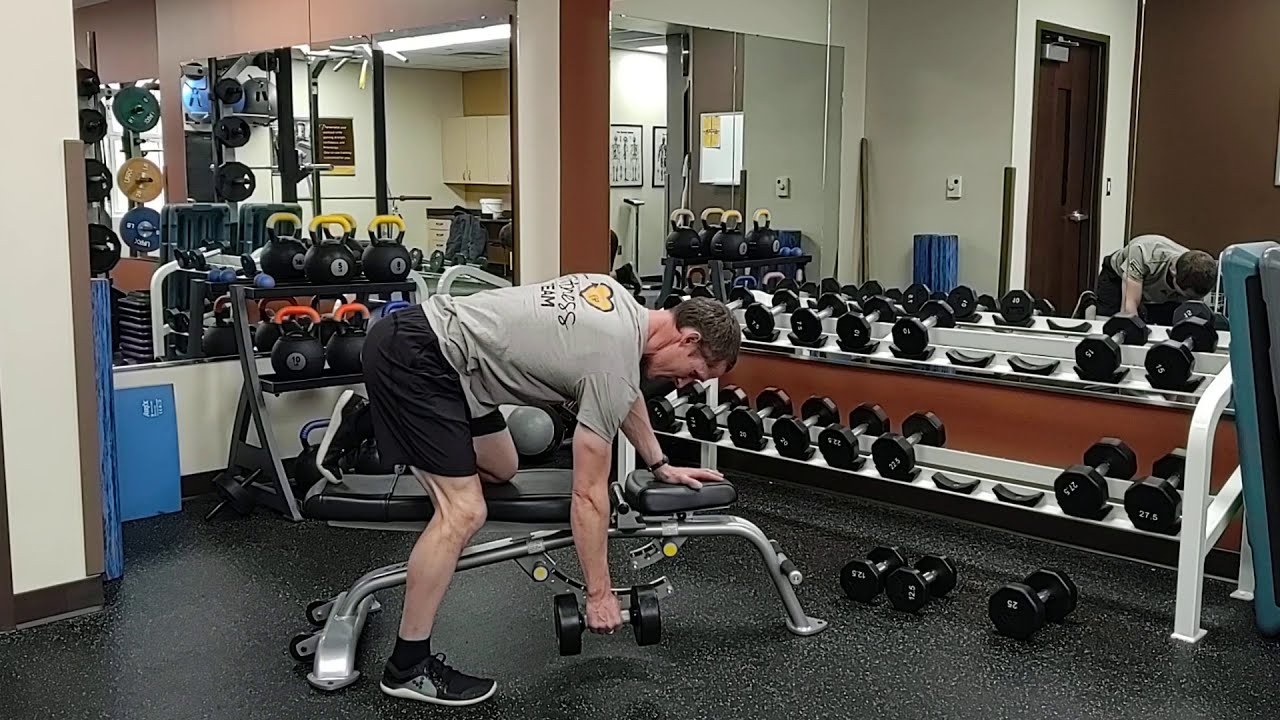 SA Dumbbell Row on Bench demonstrated by University of Wyoming Campus Recreation staff (frame from official video)