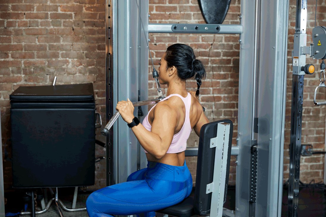 Lat Pulldowns demonstrated (Verywell Fit lead image)